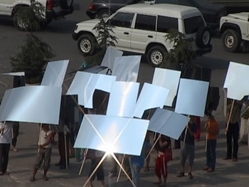 demonstrators marching in silence through the streets of Tirana with blank mirrors