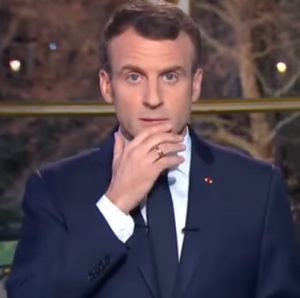 Macron scratching his chin